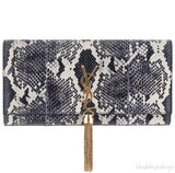 Casandra Monogram Tassle Clutch