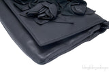 Rosette-appliquéd Leather Clutch