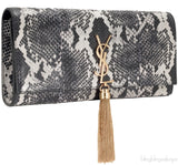 Casandra Monogram Tassle Clutch