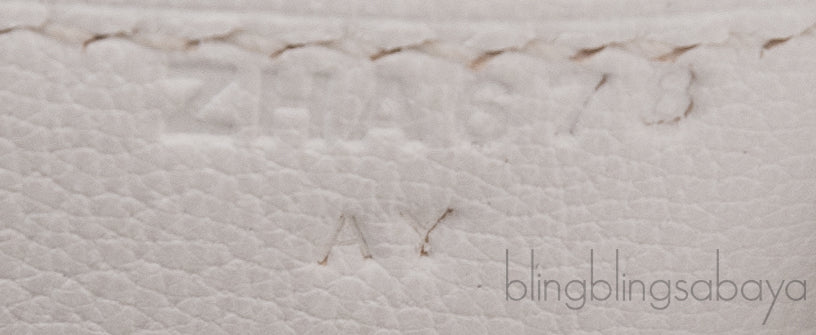Roulis Mini Veau Evercolor Blanc