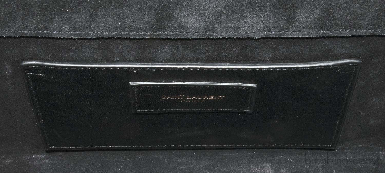 Casandra Monogram Tassle Clutch
