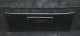 Casandra Monogram Tassle Clutch