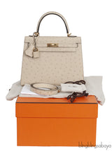 Kelly 25 Parchemin Ostrich GHW