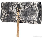 Casandra Monogram Tassle Clutch